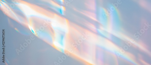 Reflective light creating prismatic patterns on a white surface in soft focus