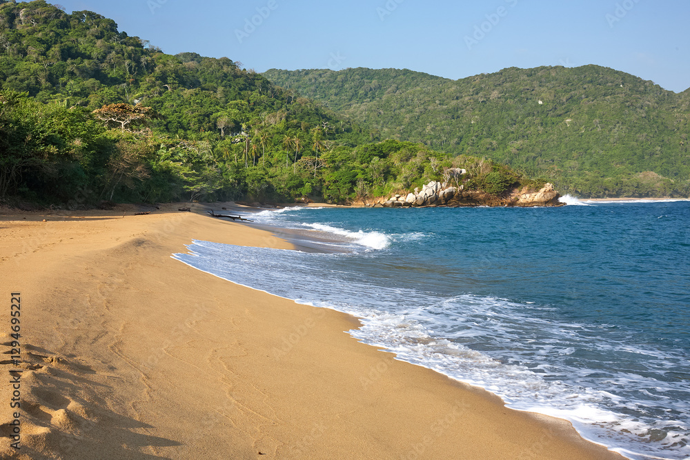 The pristine beaches of Tayrona National Park invite you to a world where turquoise waters meet golden sands, framed by lush tropical forests. A true Colombian gem. The pristine beaches of Tayrona National Park invite you to a world where turquoise waters meet golden sands, framed by lush tropical forests. A true Colombian gem.