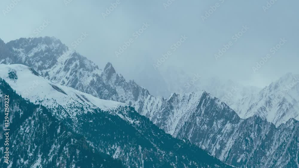 4K Time lapse shot of dark stormy clouds above the snowy Himalayan mountain peaks during the winter season at Sonmarg in Jammu and Kashmir, India. Winter stormy clouds above Himalayas of Pir Panjal. 4K Time lapse shot of dark stormy clouds above the snowy Himalayan mountain peaks during the winter season at Sonmarg in Jammu and Kashmir, India. Winter stormy clouds above Himalayas of Pir Panjal.
