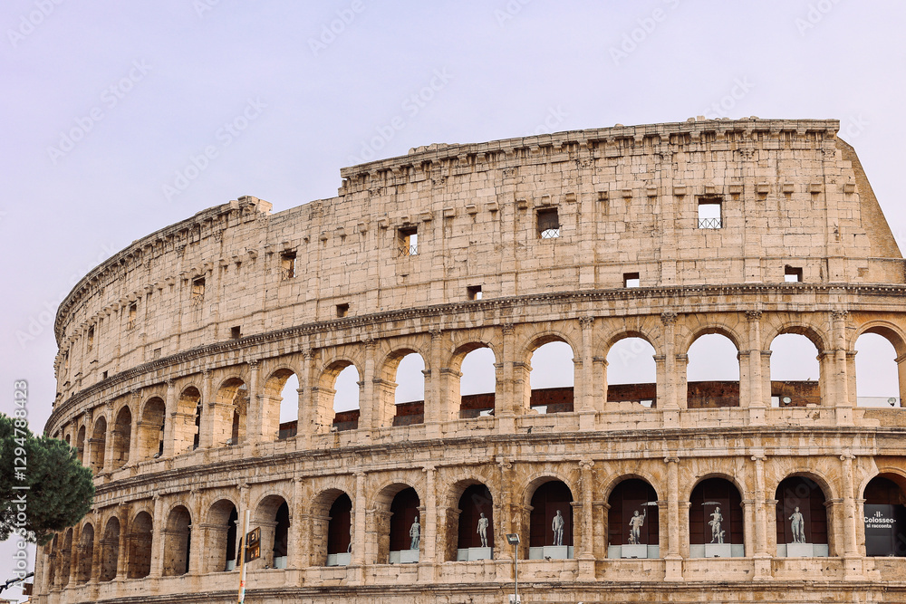 Obraz premium Panoramic view of old Colosseum in Rome. Beautiful popular of ancient landmark. Famous card of city of Rome, Italy. High quality photo