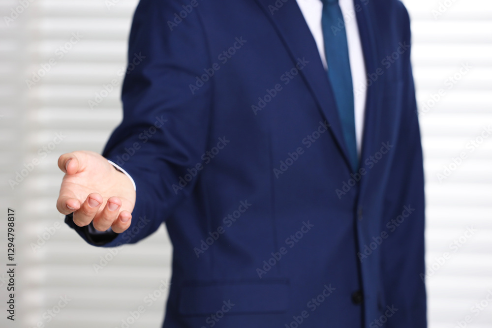 Man offering helping hand on light background, closeup Man offering helping hand on light background, closeup