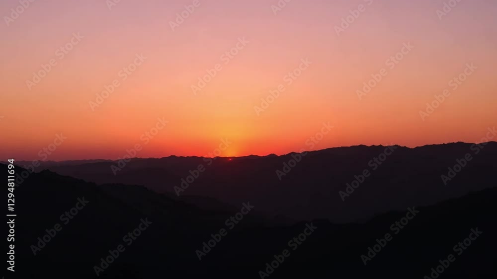 A beautiful sunset over rolling hills with a deep orange sky, creating a peaceful evening scene. A beautiful sunset over rolling hills with a deep orange sky, creating a peaceful evening scene.