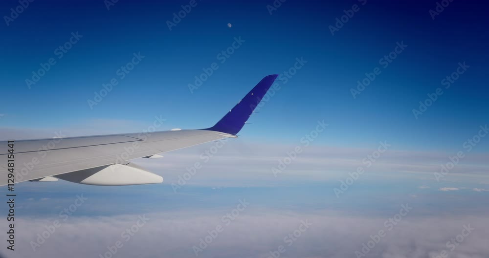 Travel with airplane over horizon, plane flying above clouds on a nice sunny day Travel with airplane over horizon, plane flying above clouds on a nice sunny day