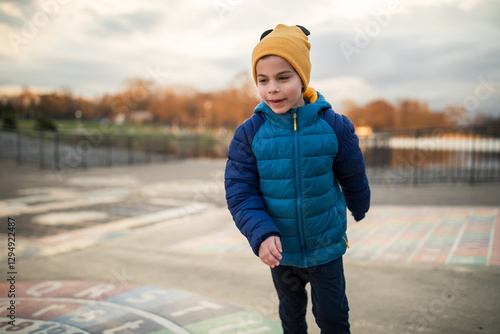 Obraz na płótnie Portrait of little adorable boy walking in park w salonie