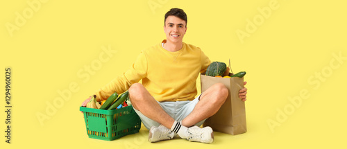 Young man with full shoppin...