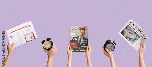 Hands holding alarm clocks,...