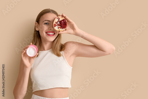 Young woman with pomegranat...