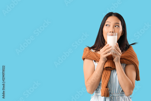Young Asian woman with glas...