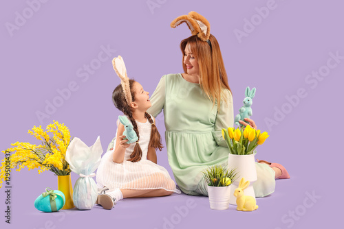 Cute little girl with her m...
