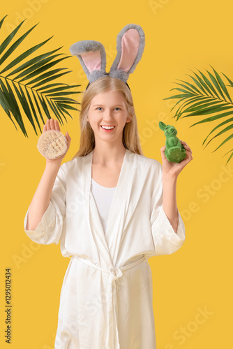 Happy young woman holding m...