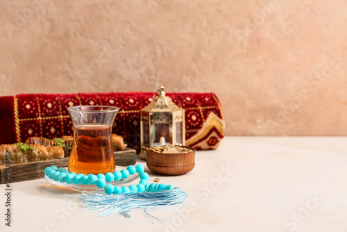 Prayer beads, glass cup of ...