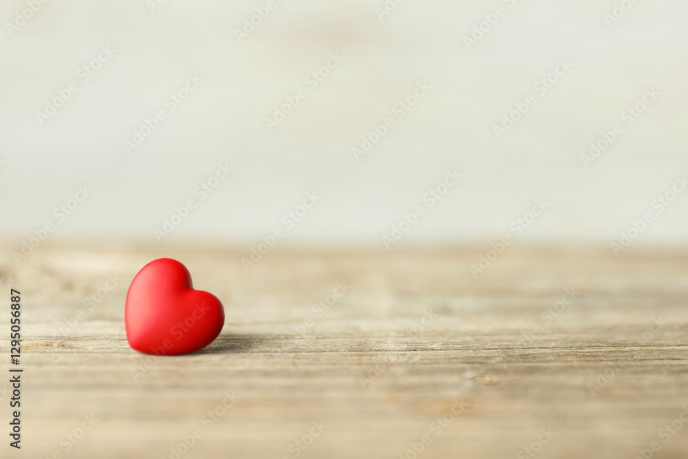 Fototapeta premium Red decorative heart on wooden table, space for text. Happy Valentine's day