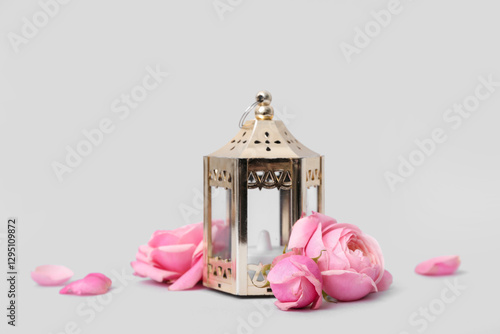 Golden lantern with pink ro...