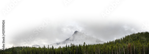 Photography Panorama of a pyramid shaped mountain in the clouds with a forest in the foregro