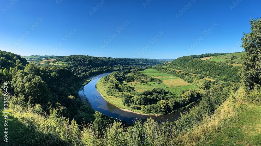 Fototapeta premium lush greenery and winding river against a clear blue sky