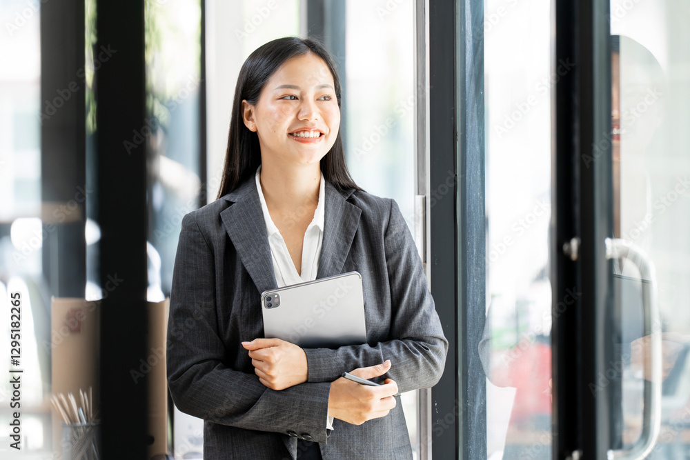Portrait of happy businesswoman with touchpad in office Portrait of happy businesswoman with touchpad in office