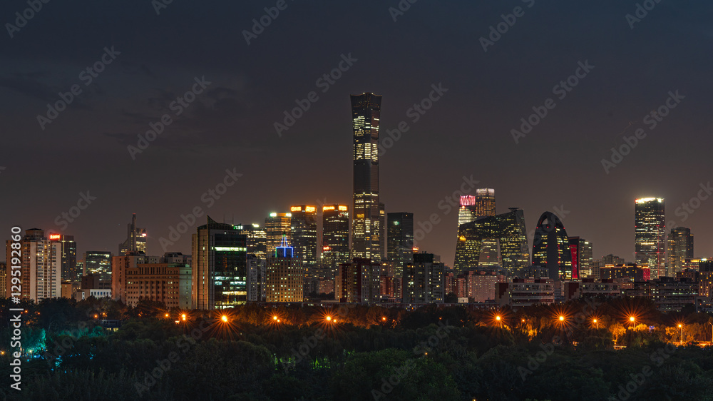 Fototapeta premium The night scene of the China World Trade Center in Beijing, China, with modern architecture and dazzling lights