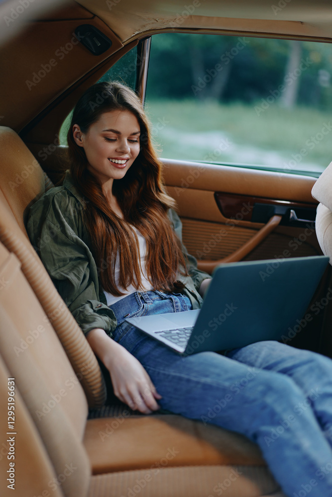 Young woman working on a laptop inside a car, wearing casual clothes, smiling, with a natural green background promoting remote work and digital nomad lifestyle. Young woman working on a laptop inside a car, wearing casual clothes, smiling, with a natural green background promoting remote work and digital nomad lifestyle.