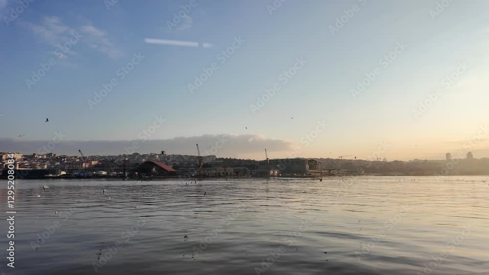 Beautiful sunset over water with serene city skyline Beautiful sunset over water with serene city skyline