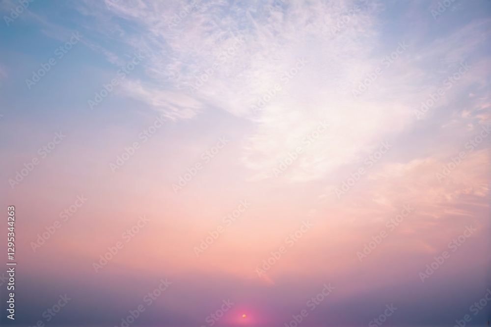 Fototapeta premium Serene Sunset Landscape with Soft Colors and Wispy Clouds