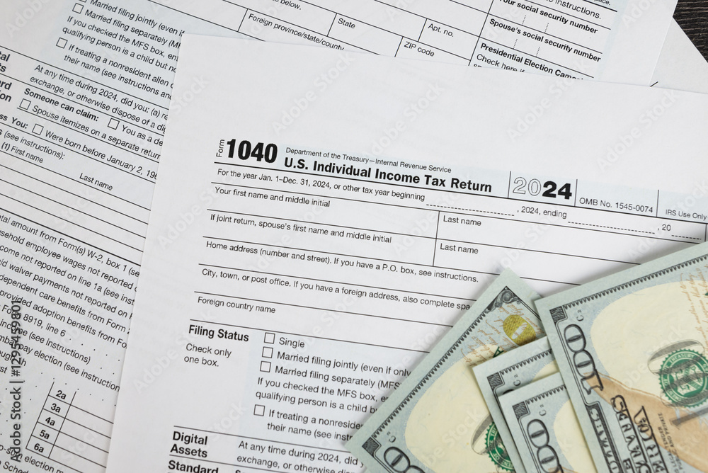 Tax form 1040 on dark wooden background, financial document. Tax form 1040 on dark wooden background, financial document.