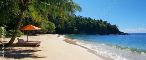 Tropical beach scene with chaise lounge and umbrella