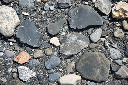Wallpaper Mural Coastal pebbles, beach texture, grey stones, sunlit background Torontodigital.ca