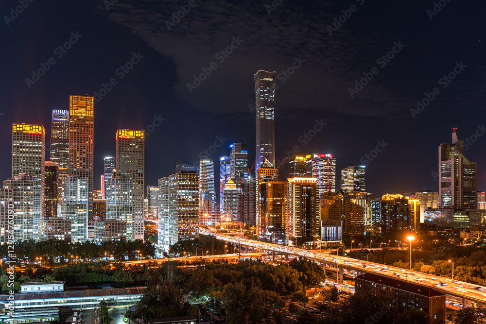 Fototapeta premium The night view of China World Trade Center in Beijing, China: The prosperous skyline outlined by the lights