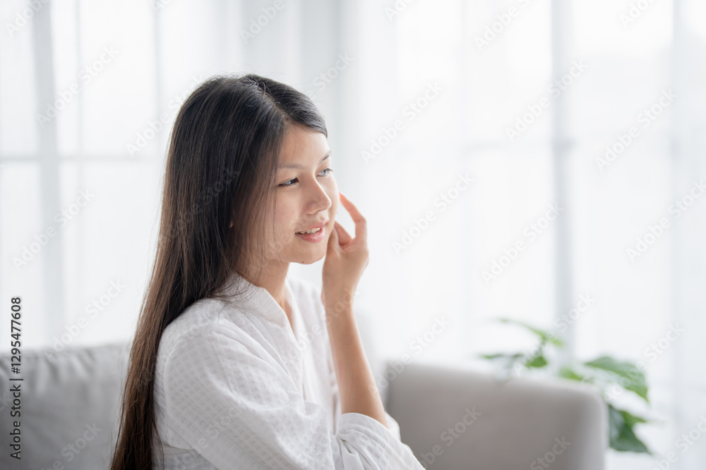 Daily beauty routine Asian woman.with clean skin uses micellar water to remove makeup Daily beauty routine Asian woman.with clean skin uses micellar water to remove makeup