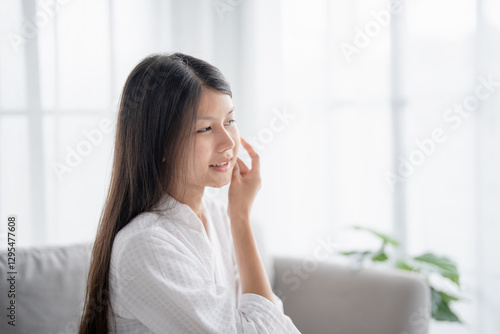 Free Download Daily beauty routine Asian woman.with clean skin uses micellar water to remove makeup - GFXLoad