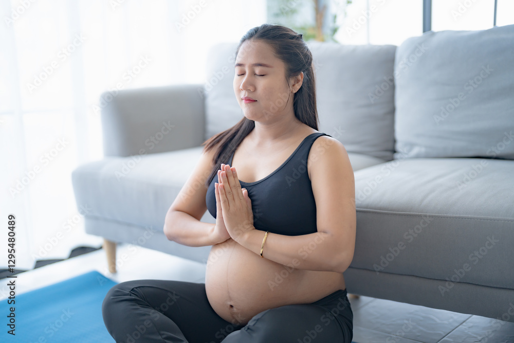 Pregnant asian woman meditation on yoga mat at home relaxation and Self-care during Pregnancy mother mindfulness Positive life moment in pregnancy time