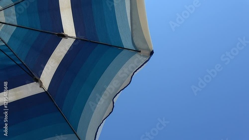 Wallpaper Mural White and shades of blue striped beach umbrellas. View from below. Blue sky. Relaxing context. Summer holidays at the sea. General contest and location Torontodigital.ca