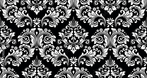 Wallpaper in the style of Baroque. White and black floral ornament. Seamless vector background. Graphic pattern for fabric, wallpaper, packaging. Ornate Damask flower illustration.