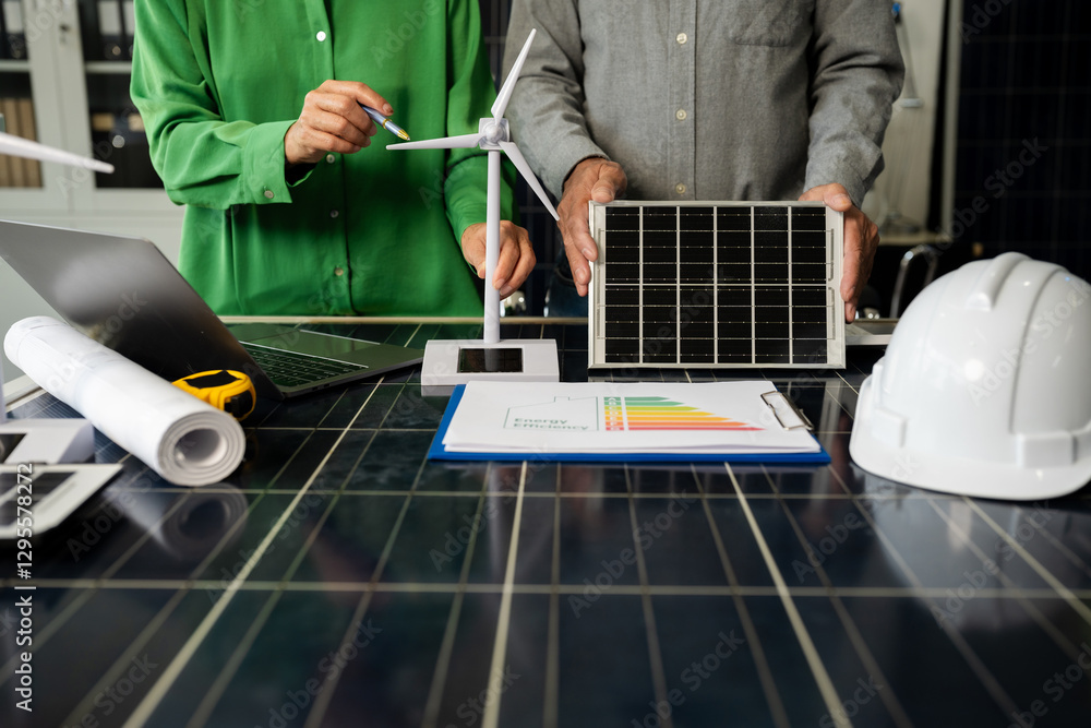 Fototapeta premium Two colleagues discussing data working and tablet, laptop with on Construction Site project.