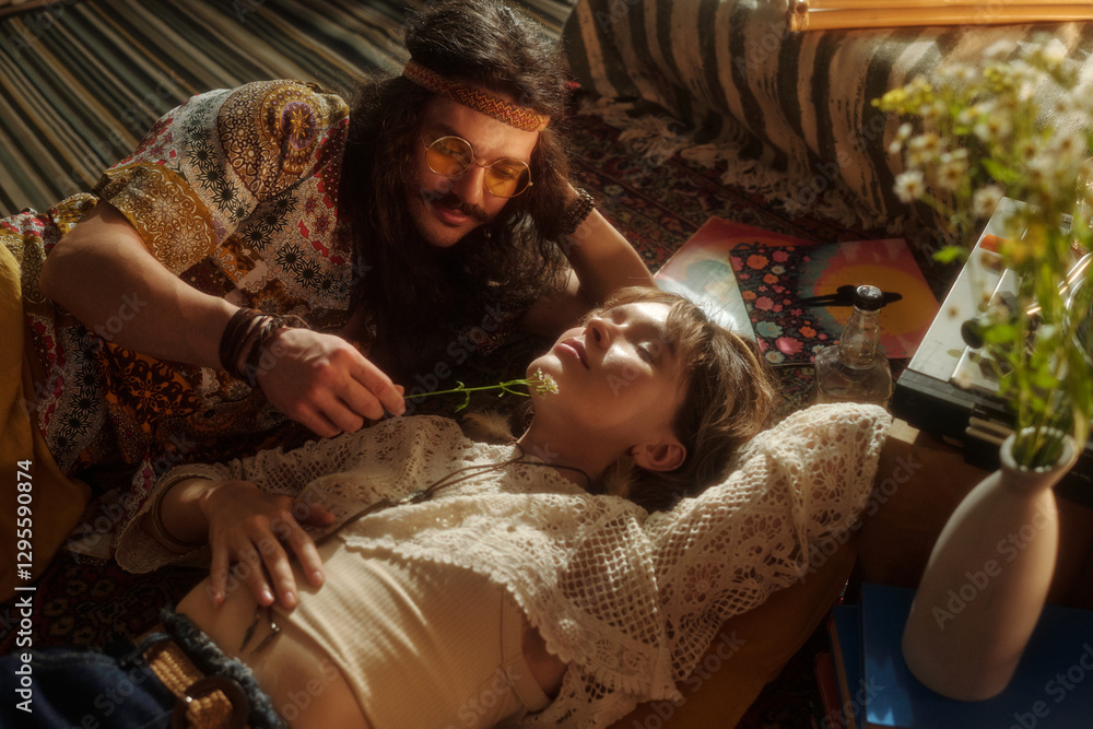 Man gently caressing woman's face using flower, creating calm atmosphere with soft lighting. Scene featuring tranquil moment with delicate gestures Man gently caressing woman's face using flower, creating calm atmosphere with soft lighting. Scene featuring tranquil moment with delicate gestures