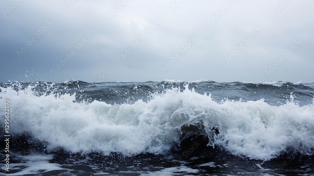 Fototapeta premium Dynamic Ocean Waves Crashing Against Dark Rocky Shore Under Overcast Sky : Generative AI
