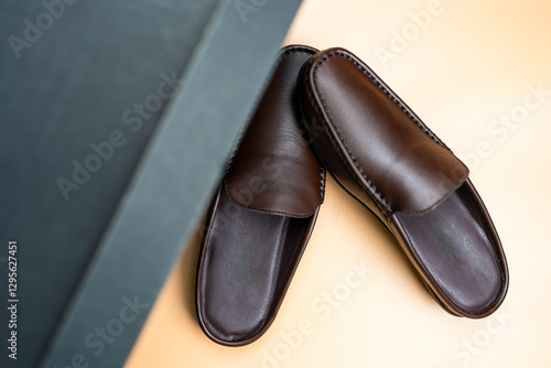 A pair of brown leather loafers,  perfect for a stylish and sophisticated look. photo