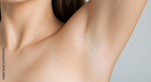 Woman Raises Arm Showing Clean Armpit Area for Beauty or Hygiene