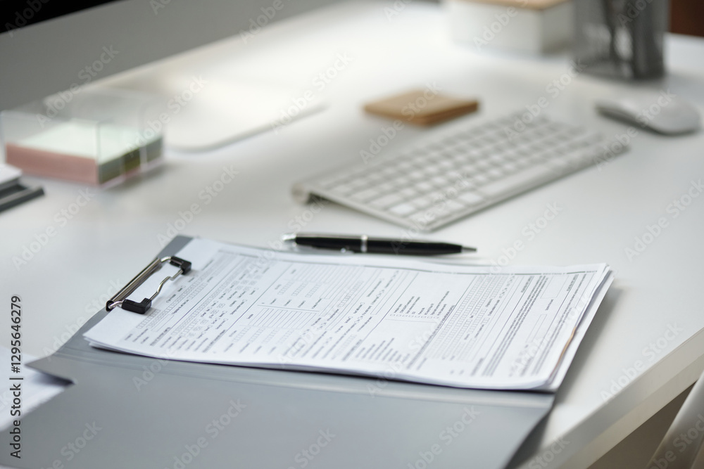 Closeup background image of document on white meeting table, no people, copy space Closeup background image of document on white meeting table, no people, copy space