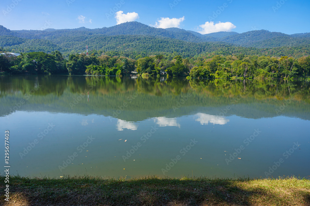 a public place leisure travel landscape lake views at Ang Kaew Chiang Mai University and Doi Suthep nature forest Mountain views spring cloudy sky background with white cloud.