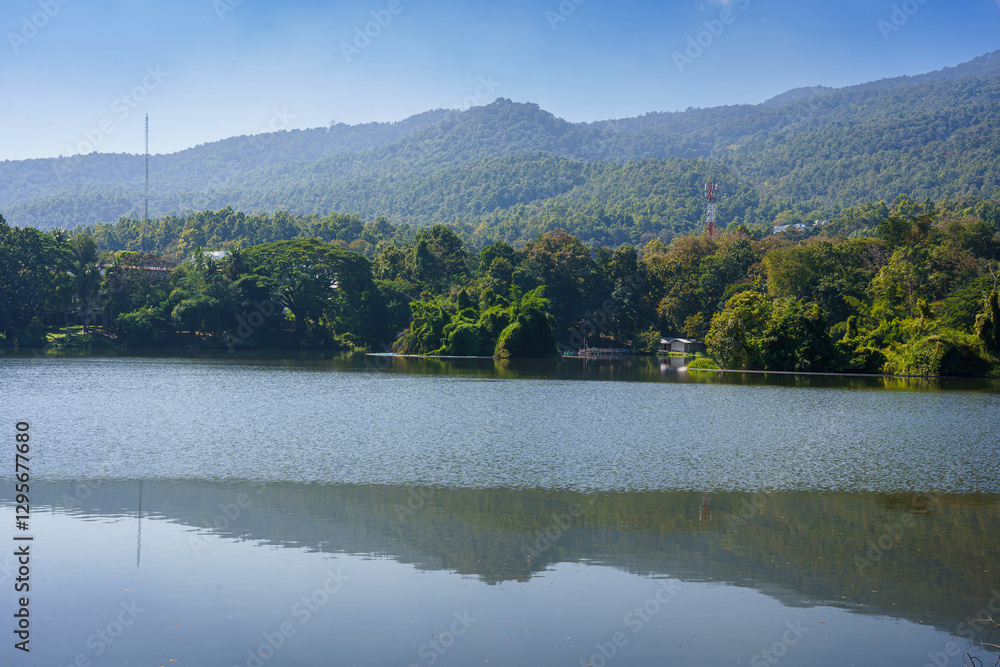a public place leisure travel landscape lake views at Ang Kaew Chiang Mai University and Doi Suthep nature forest Mountain views spring cloudy sky background with white cloud.