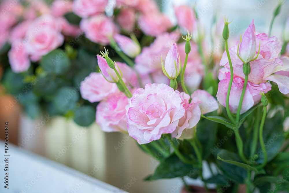 Valentine's day concept,close up Sweet color of artificial rose bouquet of red and pink roses Put with rose vase weddings interiors and decorations In a restaurant background