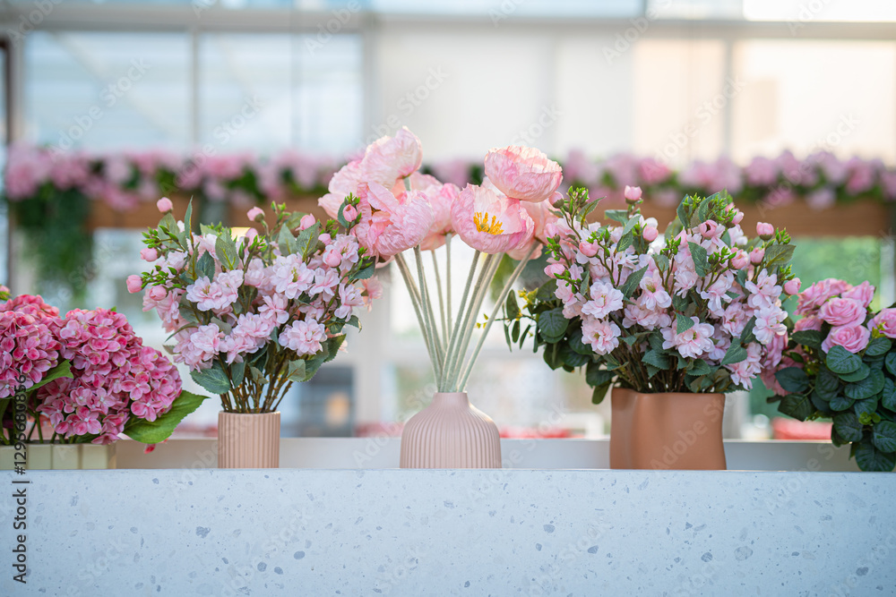 Valentine's day concept,close up Sweet color of artificial rose bouquet of red and pink roses Put with rose vase weddings interiors and decorations In a restaurant background