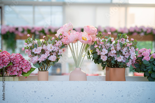 Obraz na płótnie Valentine's day concept,close up Sweet color of artificial rose bouquet of red and pink roses Put with rose vase weddings interiors and decorations In a restaurant background w salonie