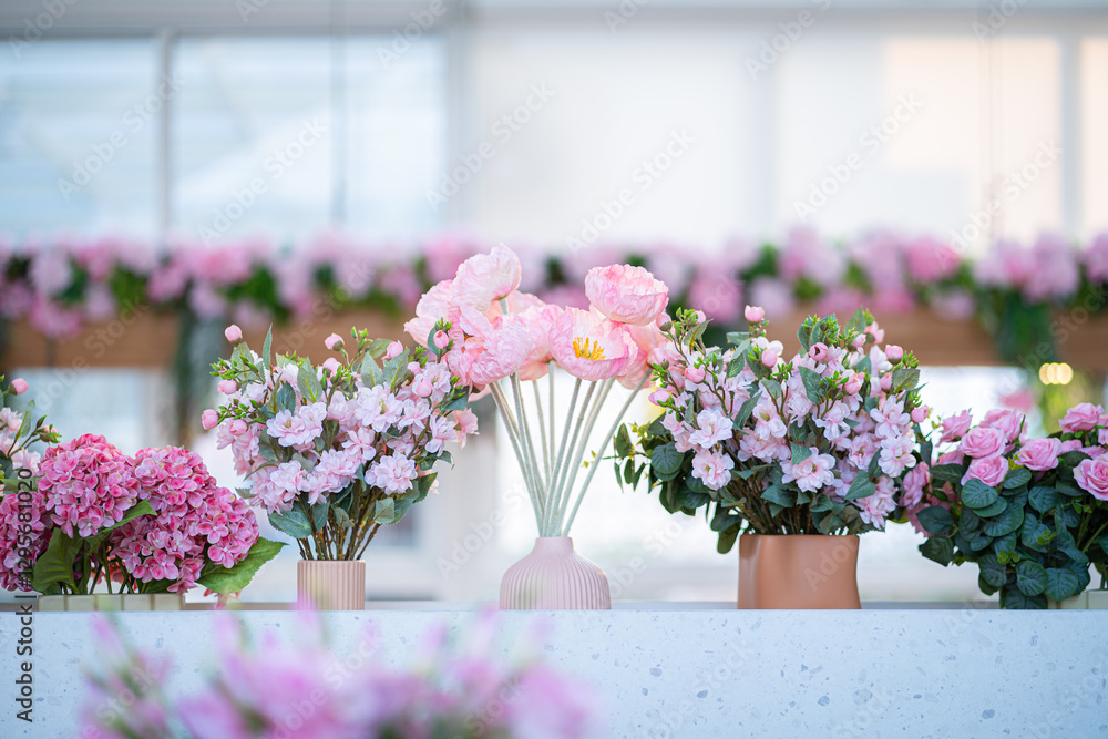 Valentine's day concept,close up Sweet color of artificial rose bouquet of red and pink roses Put with rose vase weddings interiors and decorations In a restaurant background