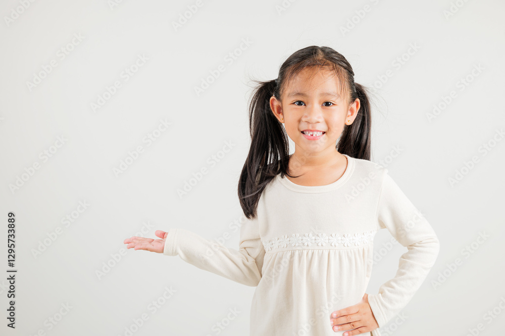 Asian happy portrait cute young girl smile presenting product holding something on palm away side, studio shot isolated on white background with copy space, kindergarten child show hand gesture Asian happy portrait cute young girl smile presenting product holding something on palm away side, studio shot isolated on white background with copy space, kindergarten child show hand gesture