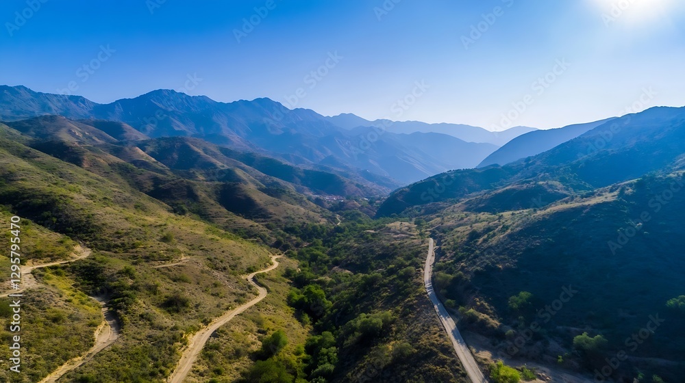 Naklejka premium Stunning Aerial View of Mountainous Landscape with Serpentine Roads Under Clear Blue Sky : Generative AI