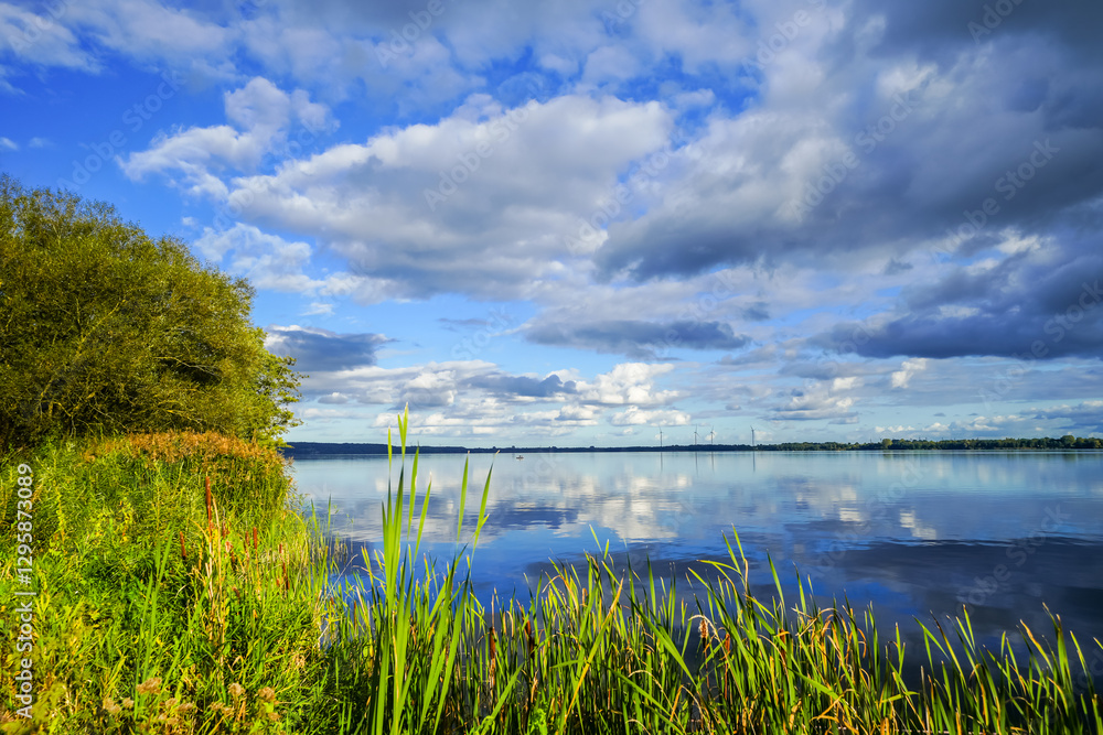 View of the Wittensee near Rendsburg in Eckernförde and the surrounding landscape. Nature by the lake.
View of the Wittensee near Rendsburg in Eckernförde and the surrounding landscape. Nature by the lake.