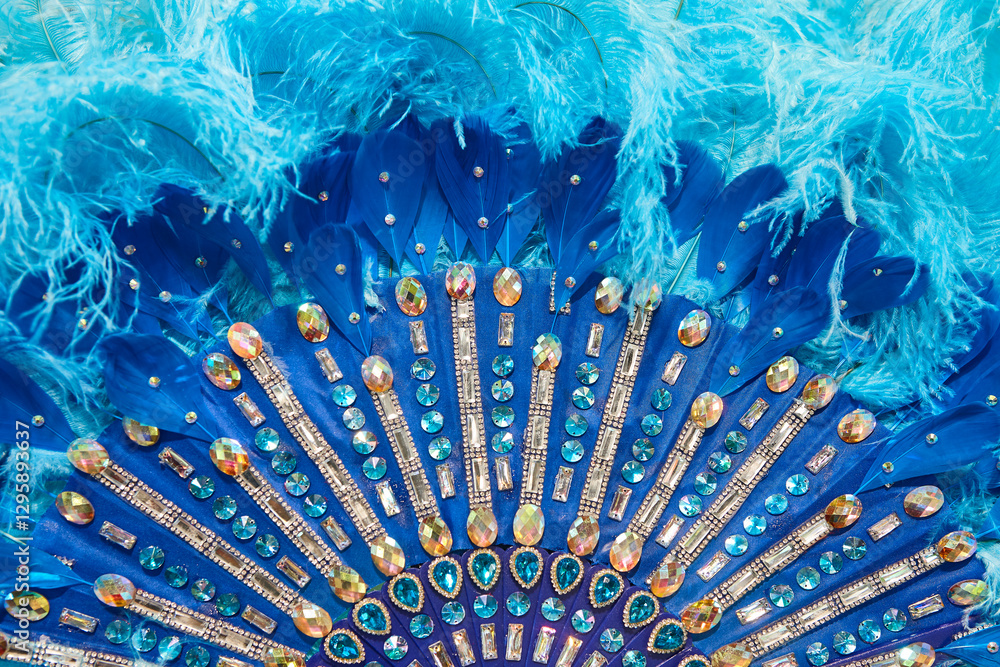 Handcrafted fan detail made with blue feathers and jewelry. Carnival