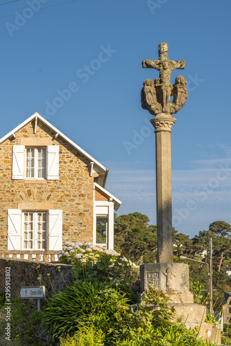 granite calvary and old villas on Trestrignel beach, Perros Guirec, Brittany, France